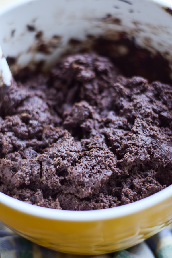 Chocolate cookie dough in a yellow bowl