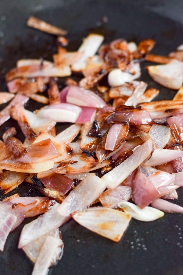 Onions sautéed in a cast iron pan
