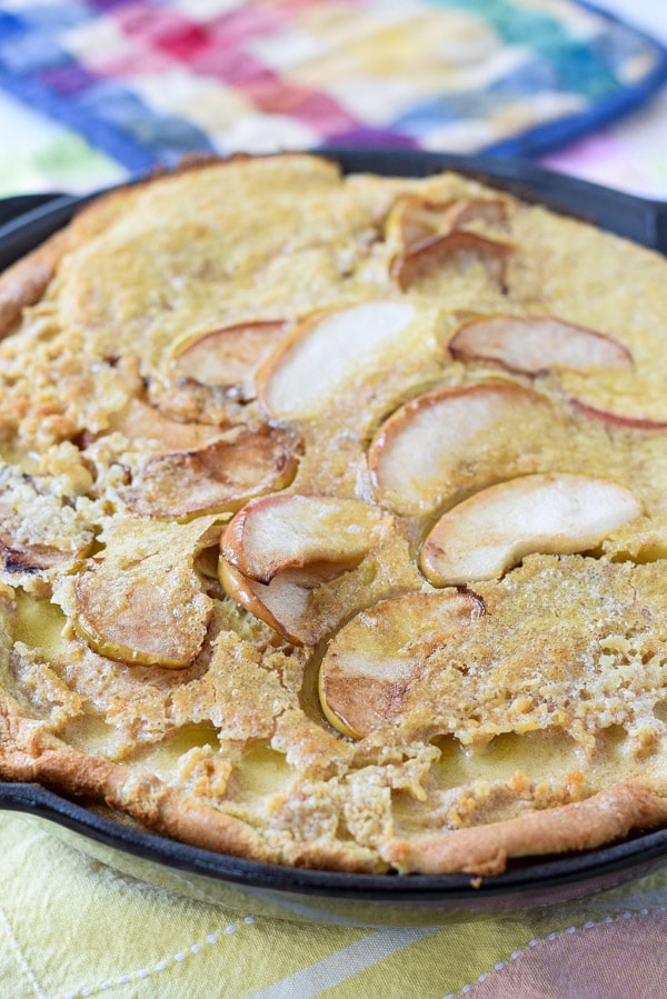 The apple pancake straight out of the oven still in the skillet