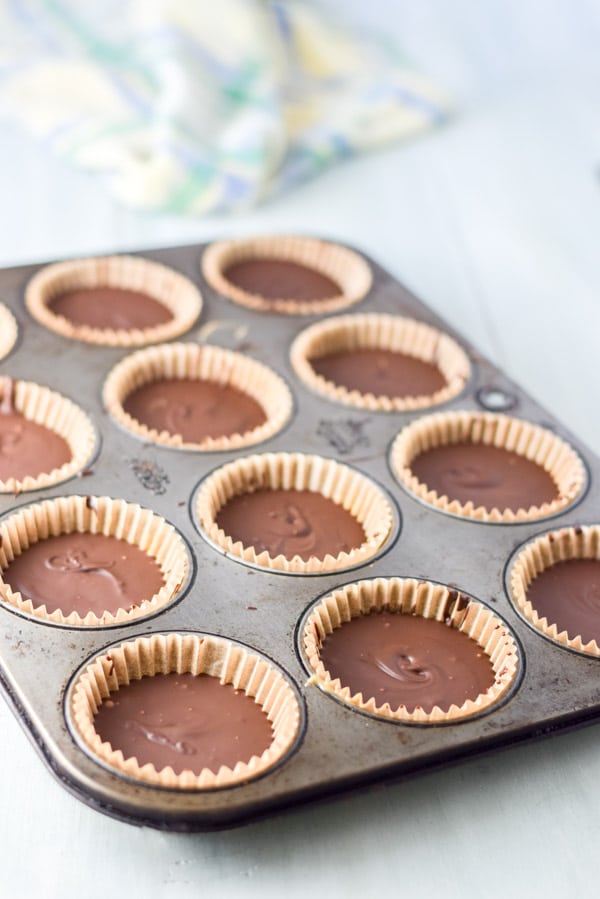 The chocolate cups still in the muffin pan but right out of the freezer