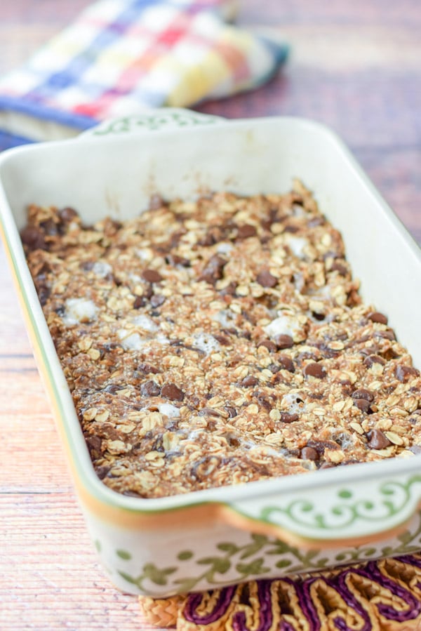 The granola bars out of the oven all melty but still in the baking dish