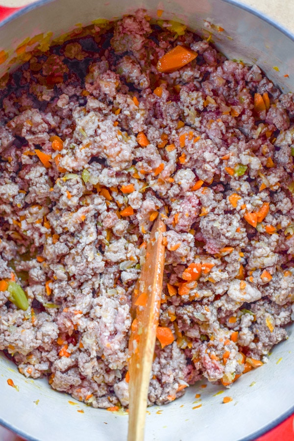 Overhead view of a pan with meat sautéd in it
