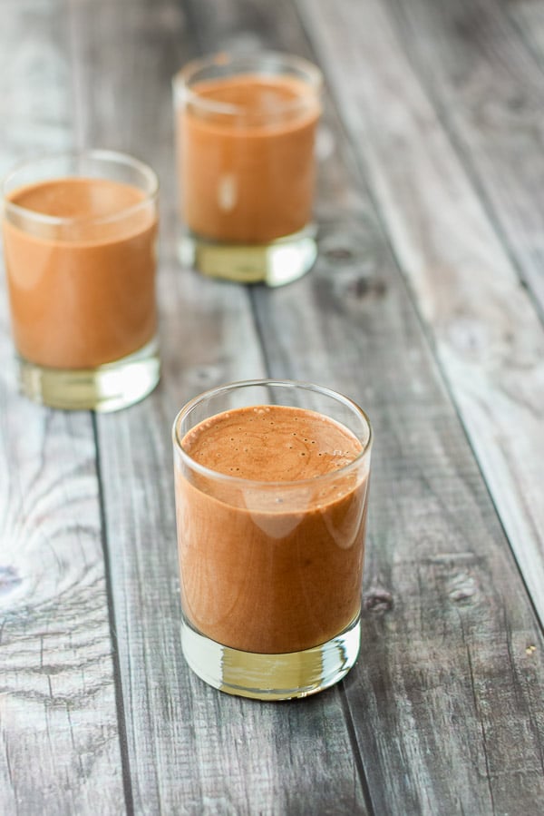 Mousse poured into three old fashioned glasses ready to be refrigerated