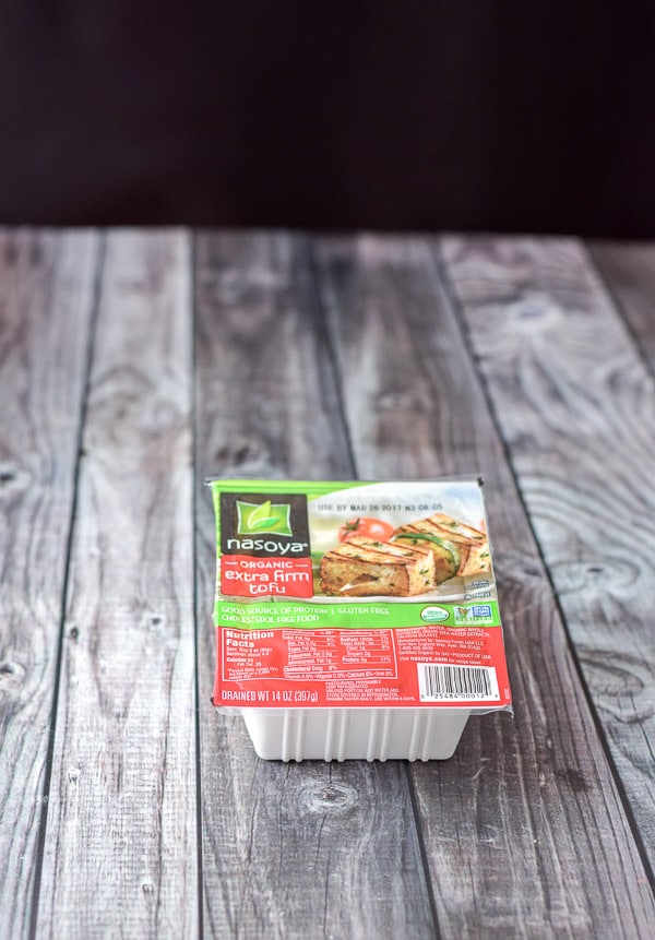 A package of tofu on a grey table