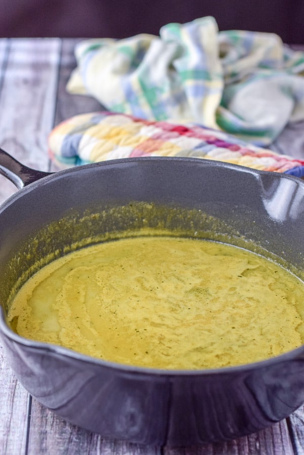 Curry sauce in a grey deep pan on a table