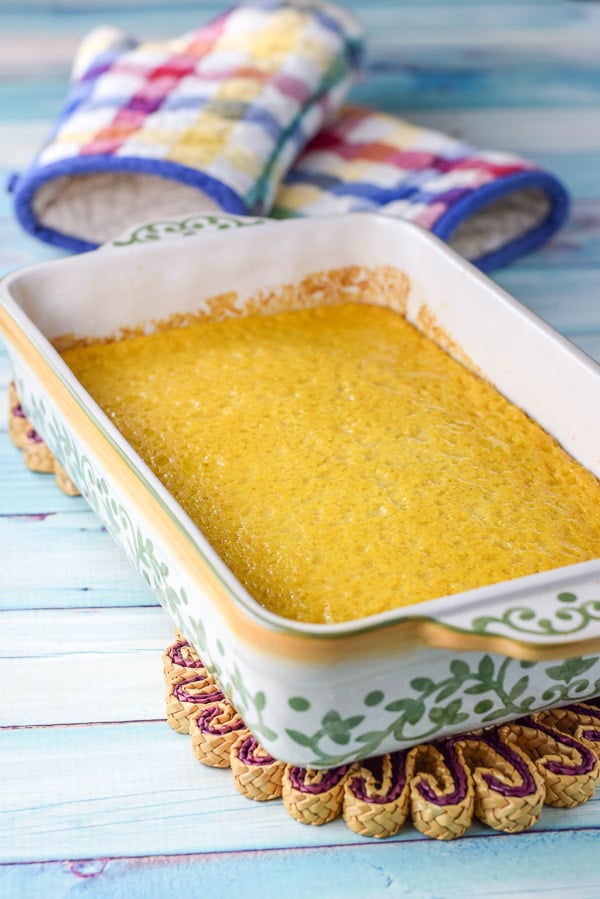 The yellow souffle fresh out of the oven still in the baking dish