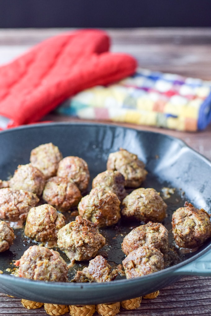 Meatballs sautéed in a cast iron sauté pan