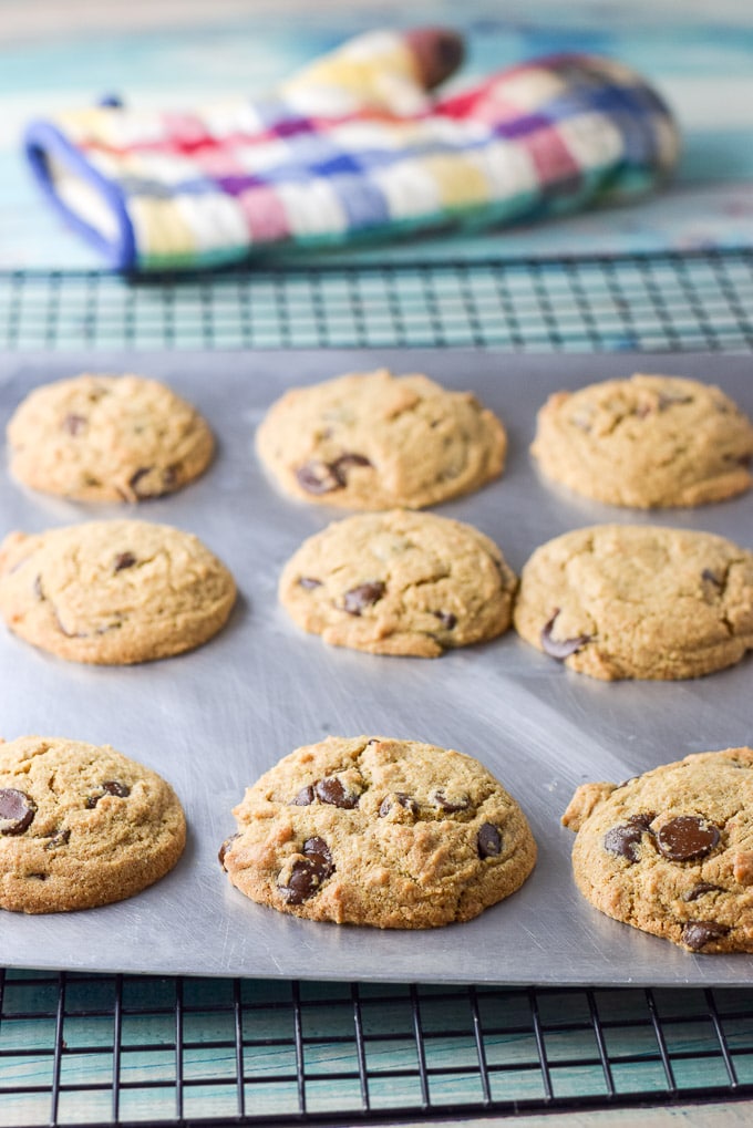Higher view of the cookies on the cookie sheet and on a wire rack