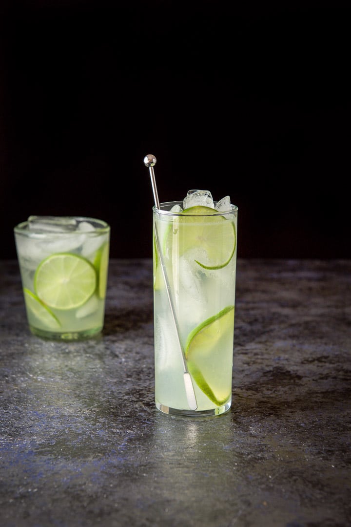 Tall glass of lime rickey with short one in the background