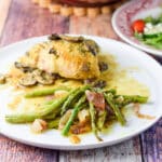 A plate with the vegetable and chicken on it - square