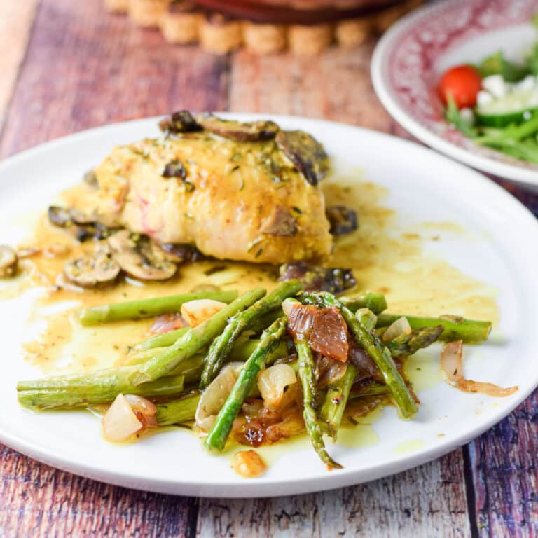 A plate with the vegetable and chicken on it - square