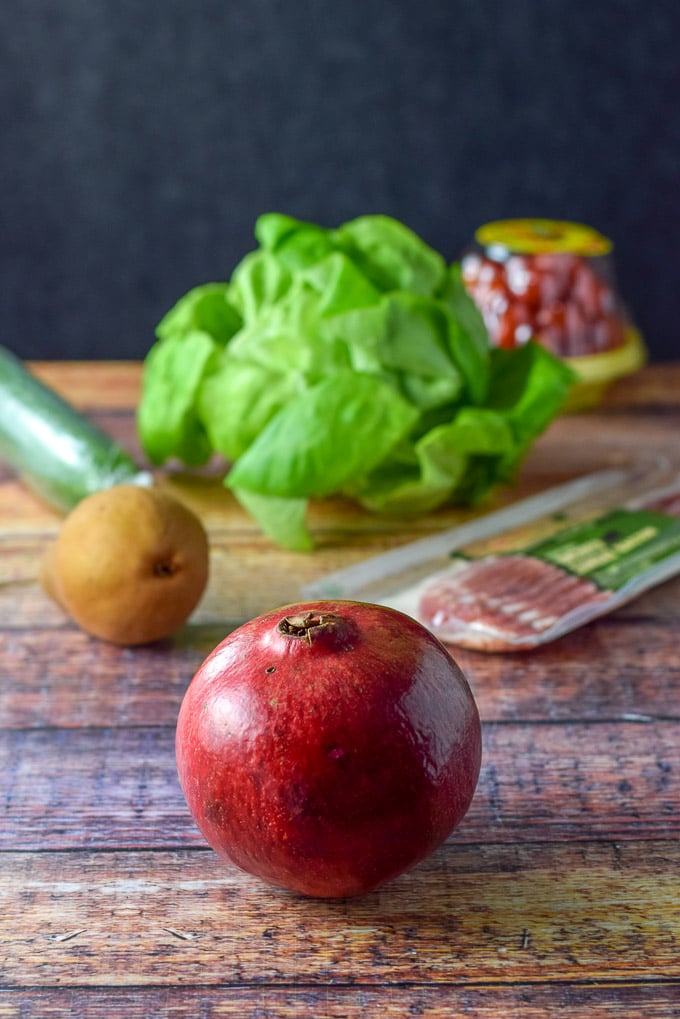 The ingredients for the salad including the Pomegranate, pear, bacon, cucumber, tomato and Boston lettuce
