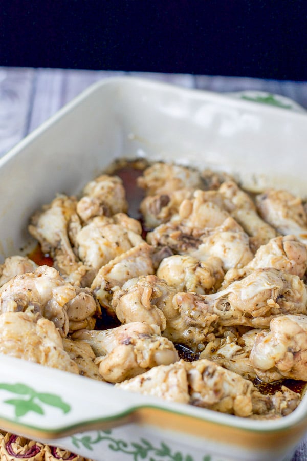 Chicken wings in a baking dish with the marinade poured over them