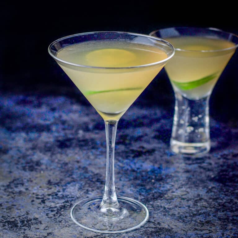 The classic martini glass filled with the daiquiri in front of the bubble glass - square