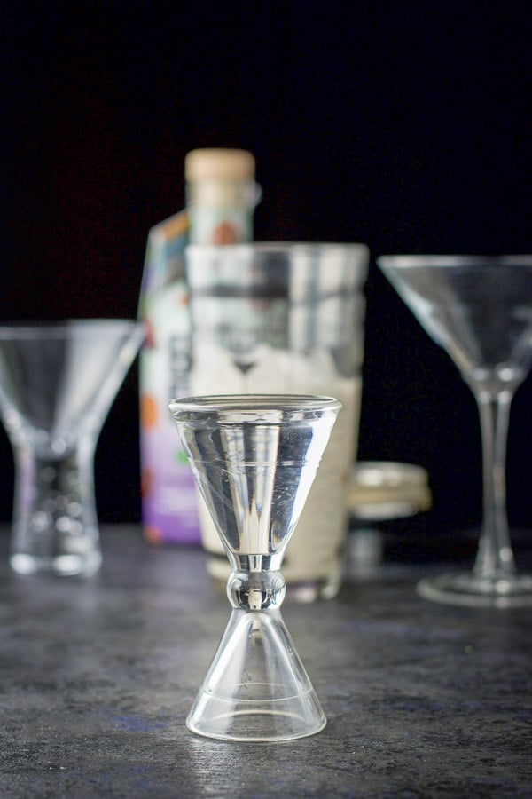 Vanilla vodka measured out with the bottle, shaker and glasses