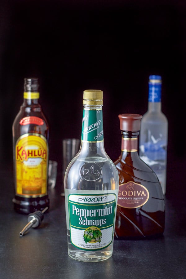 Peppermint schnapps, kahlua, chocolate liqueur and vodka on the table