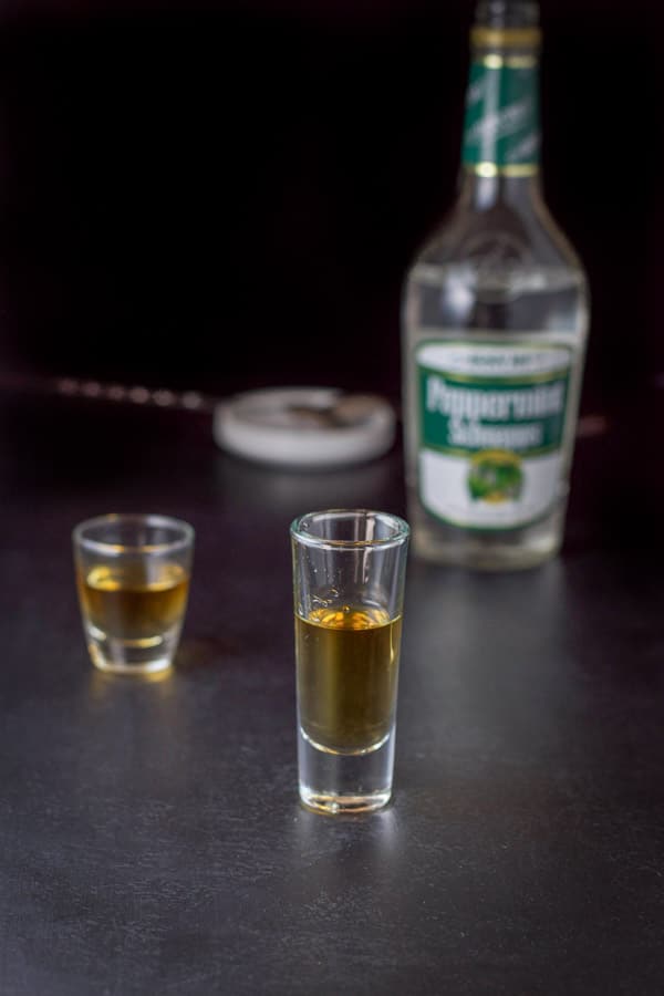 Peppermint schnapps layered in with the bottle, spoon and pourer