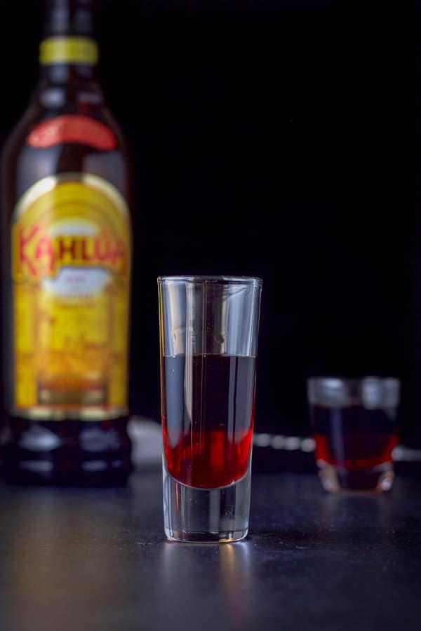Kahlúa layered into the glasses with the bottle in the background