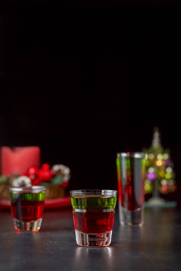 Vertical view of the Christmas shot - three glasses filled with the delicious shot Vertical view of the three glasses filled with the layered shot