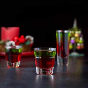 Vertical view of the three glasses filled with the layered shot - square