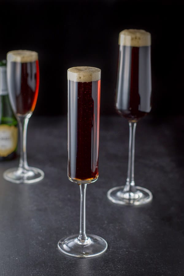 Champagne poured over the Guinness in the three glasses