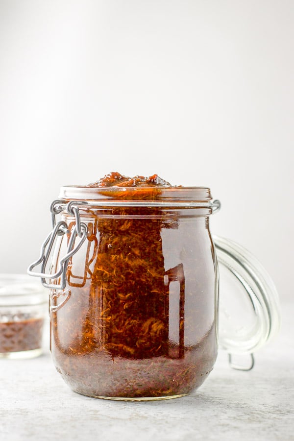 Vertical view of the spread in a jar with a smaller jar in the background
