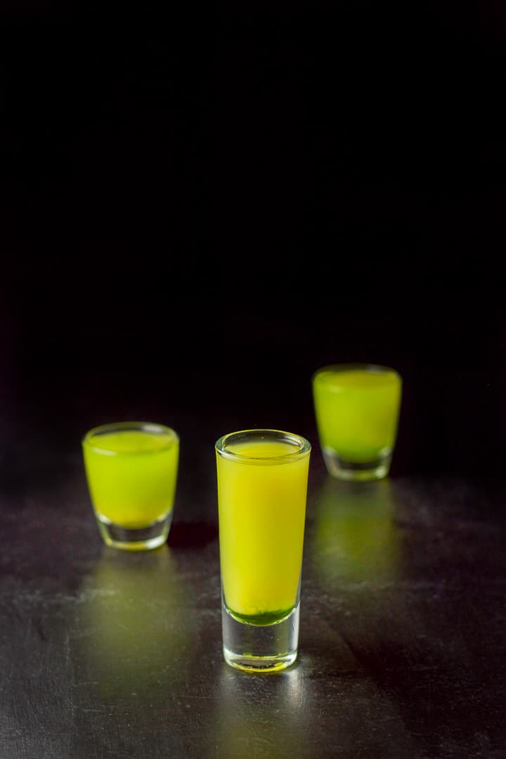 Orange juice layered into the three glasses
