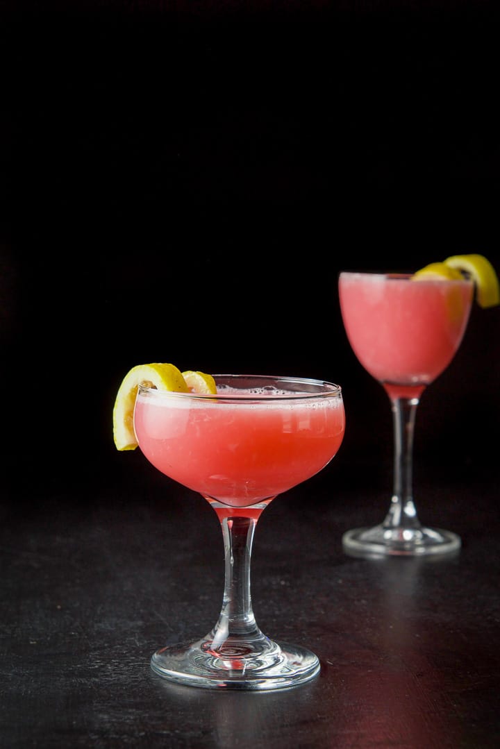 Vertical view of the pink cocktail both in the coupe glass and martini glass