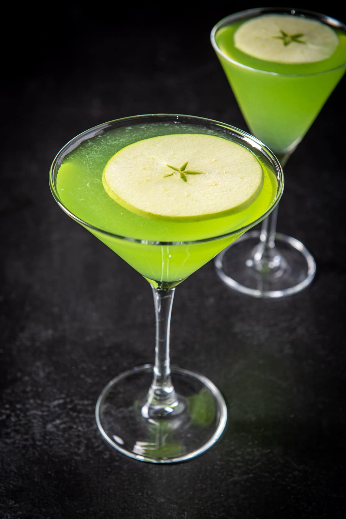 Close up of the apple floating in the apple cocktails