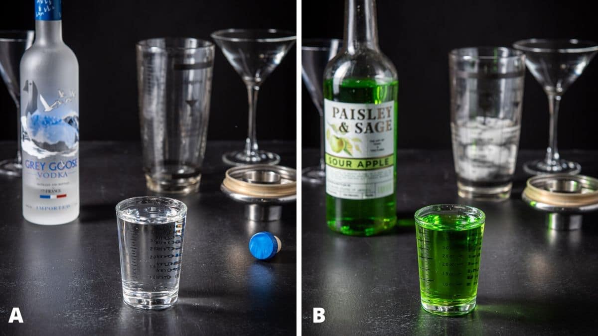 Vodka and sour apple poured with the bottles, shaker and glasses in the background