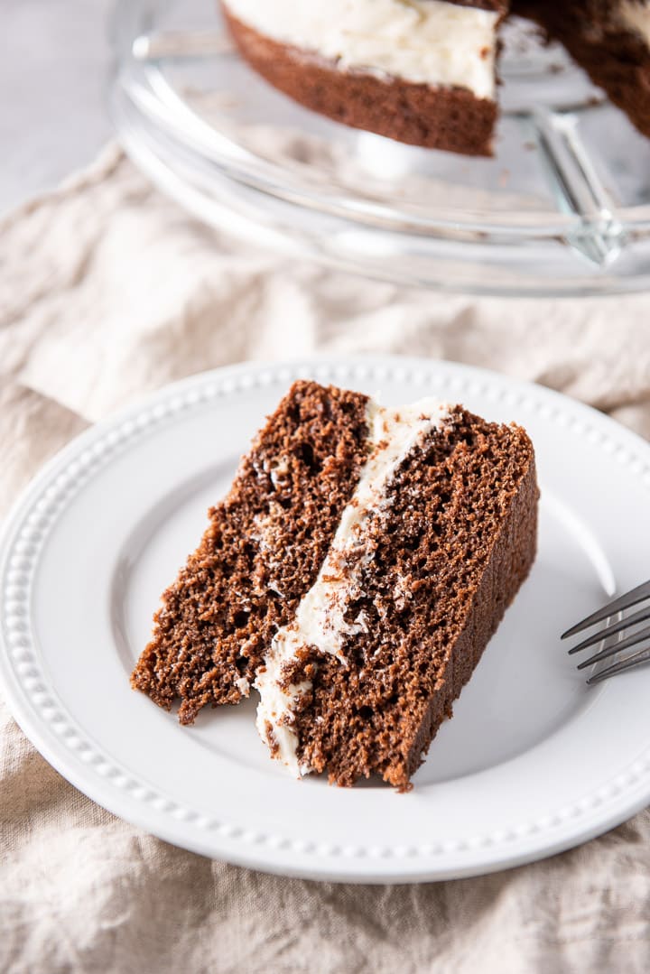 Chocolate cake on the white beaded plate