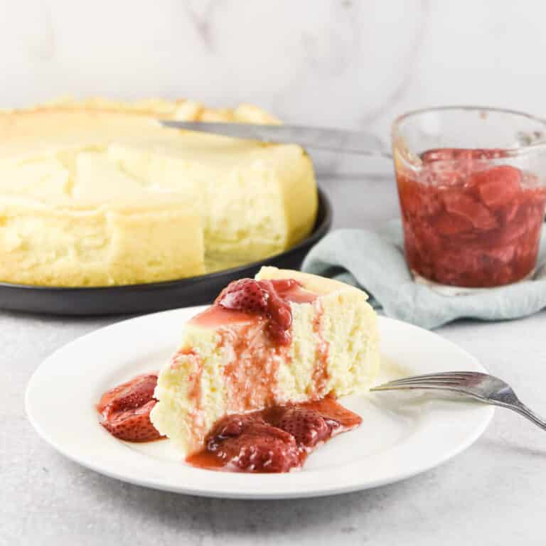 Cheesecake with sauce draped over it - square