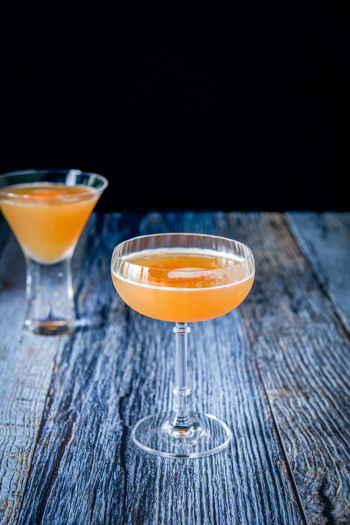 Two glasses with the brown derby in them on a table