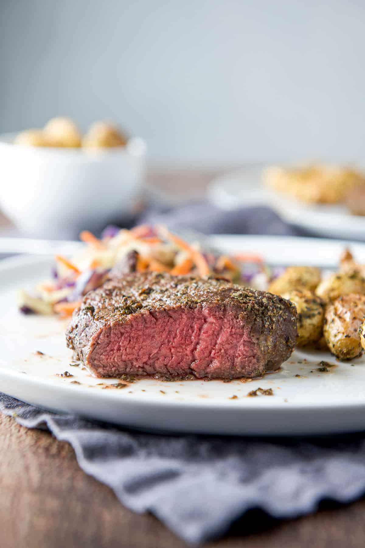 Near vertical view of the cut steak with potatoes and veggie