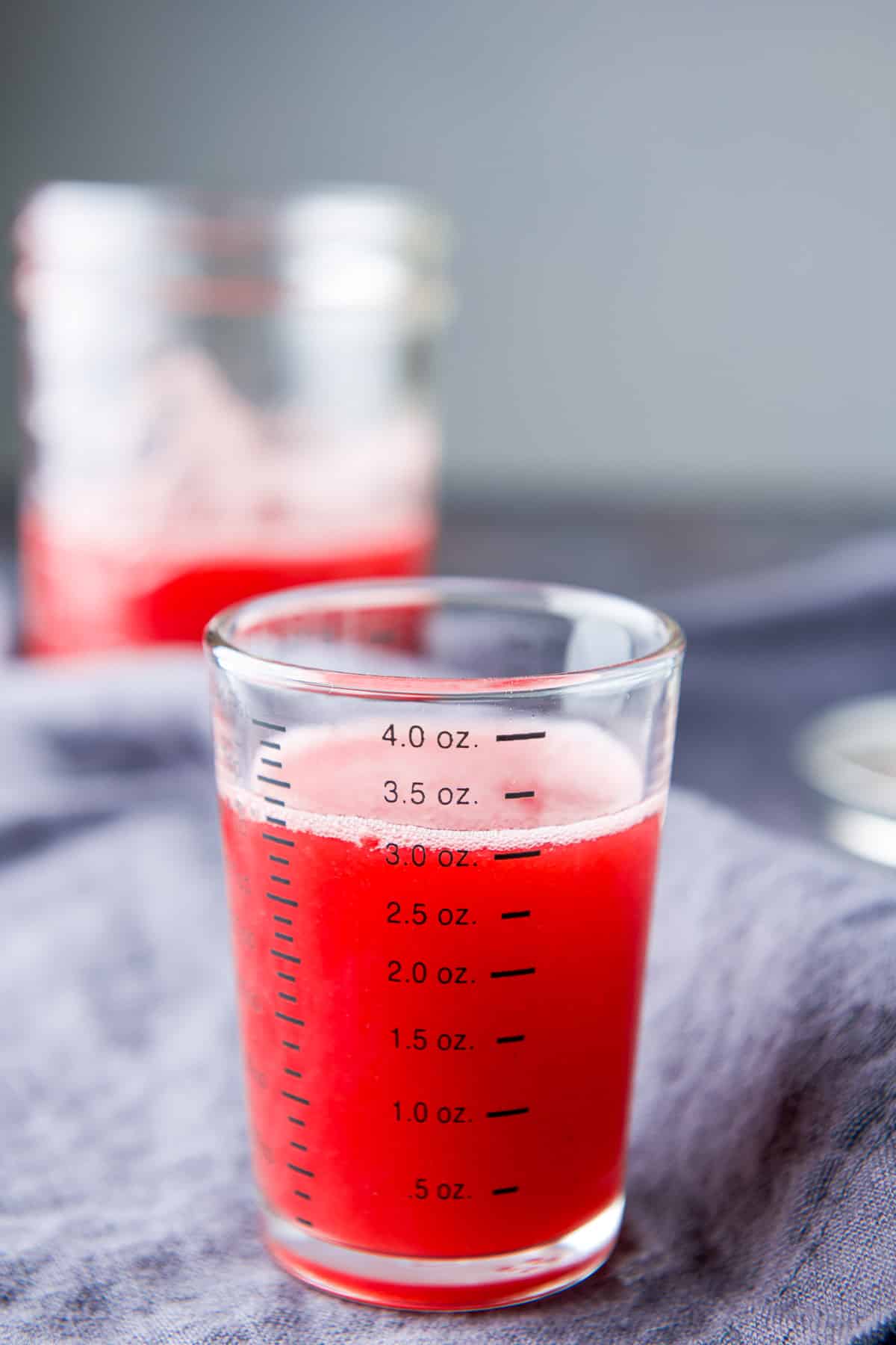 Three ounces of red raspberry syrup in it