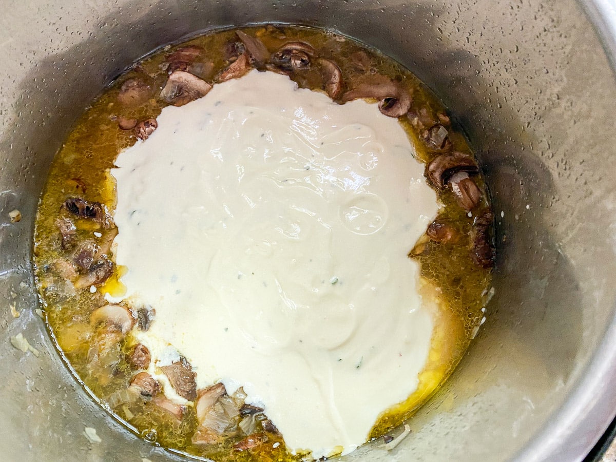 Overhead view of the sour cream sauce in with the chicken