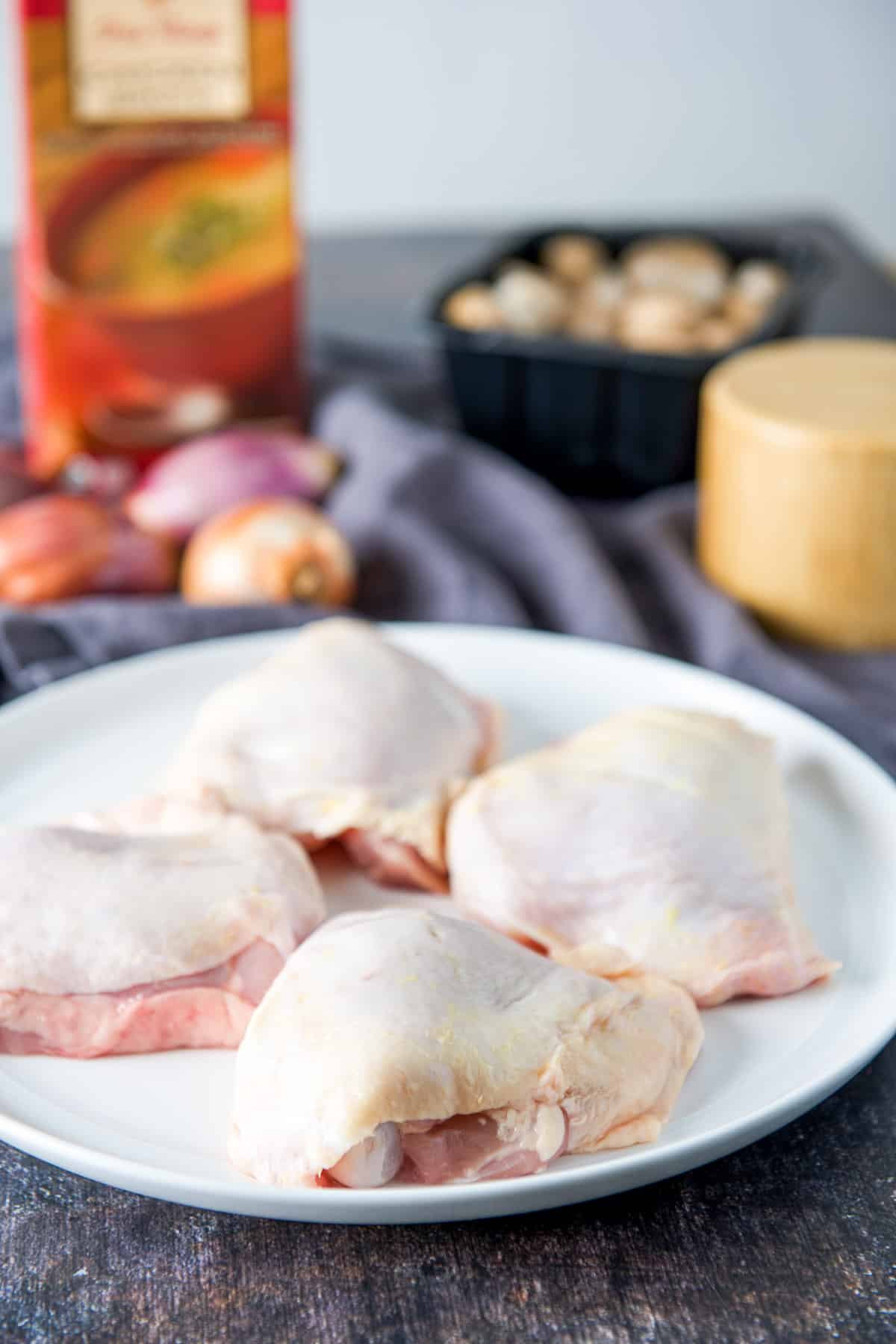 Chicken thighs, shallots, mushrooms, and broth