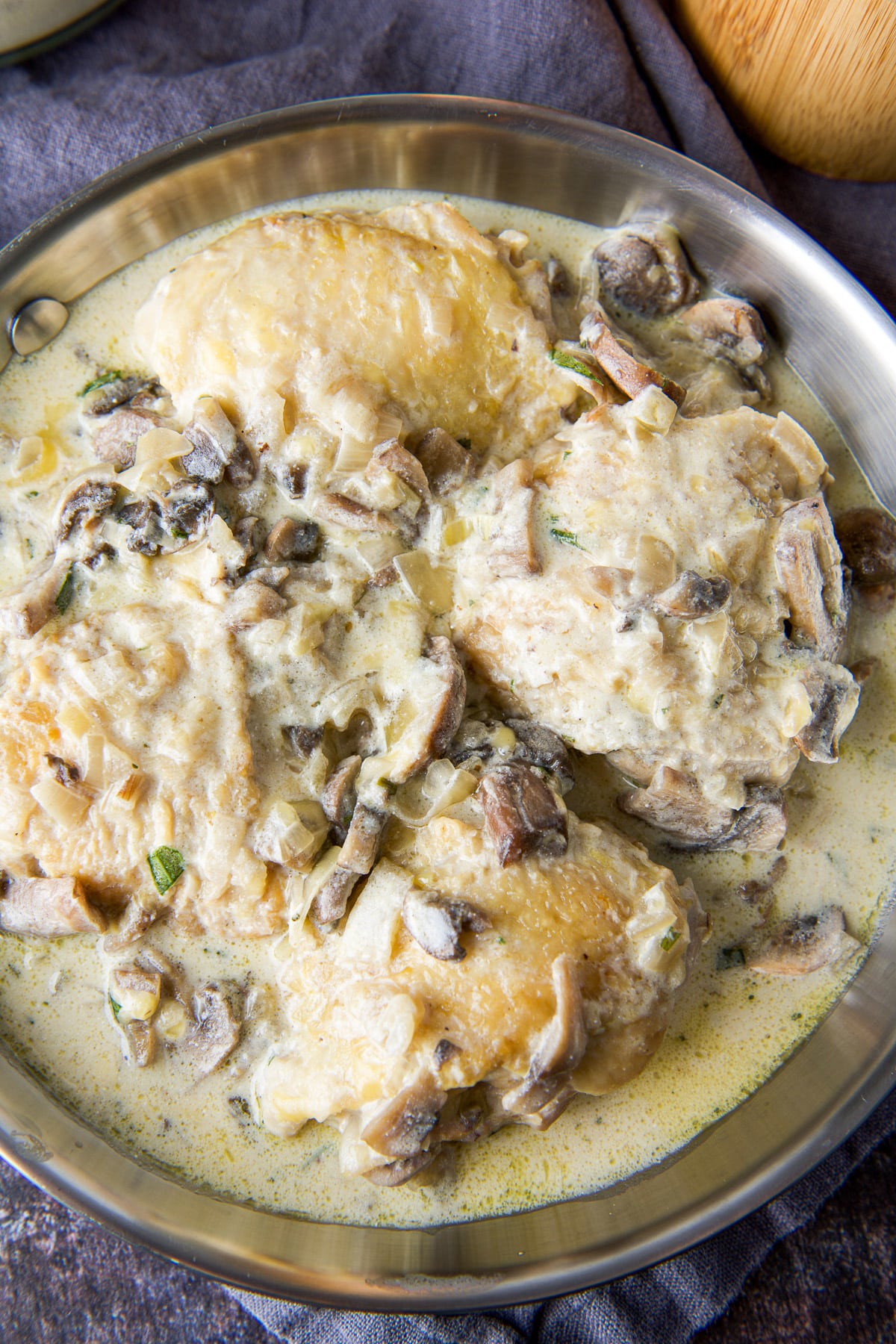 Overhead view of the pan of chicken thighs with sauce