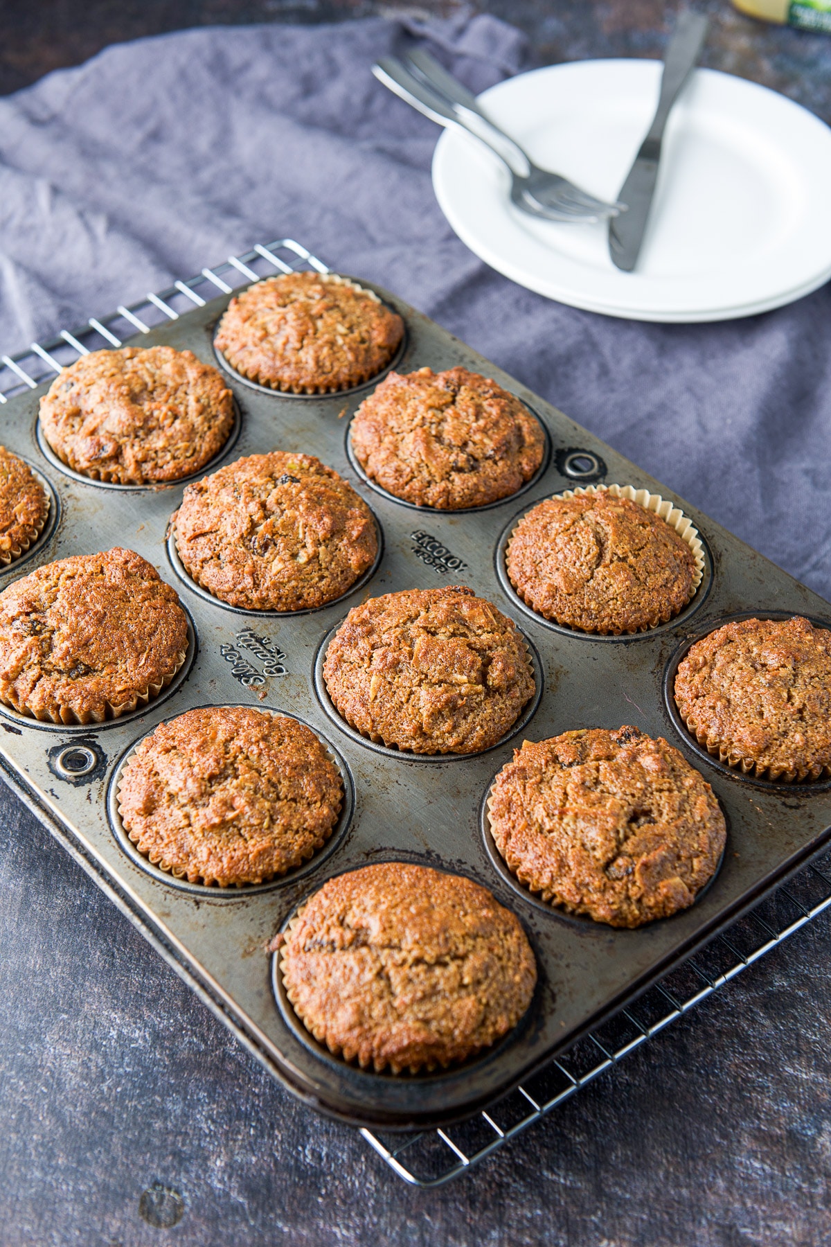 Muffins fresh out of the oven cooling on a rack