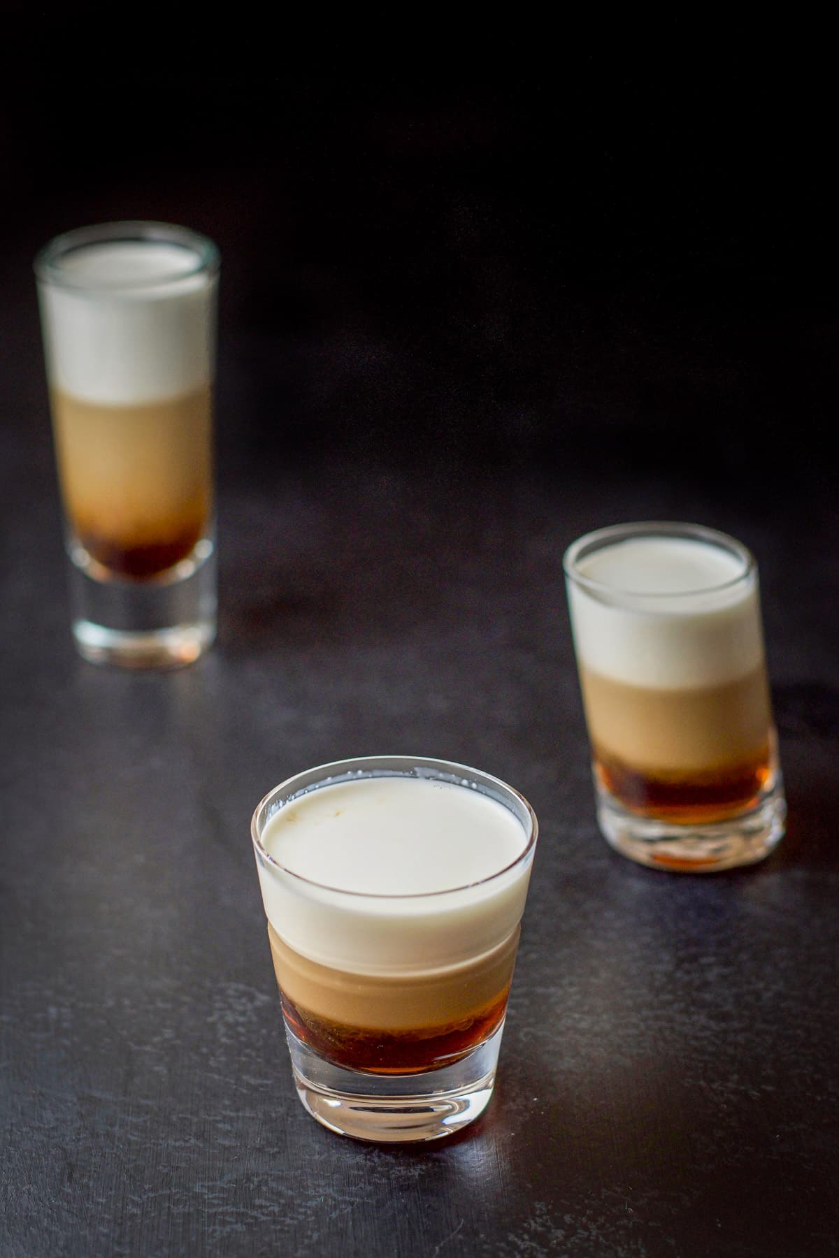 Higher view of the three layered shots with the cream on top