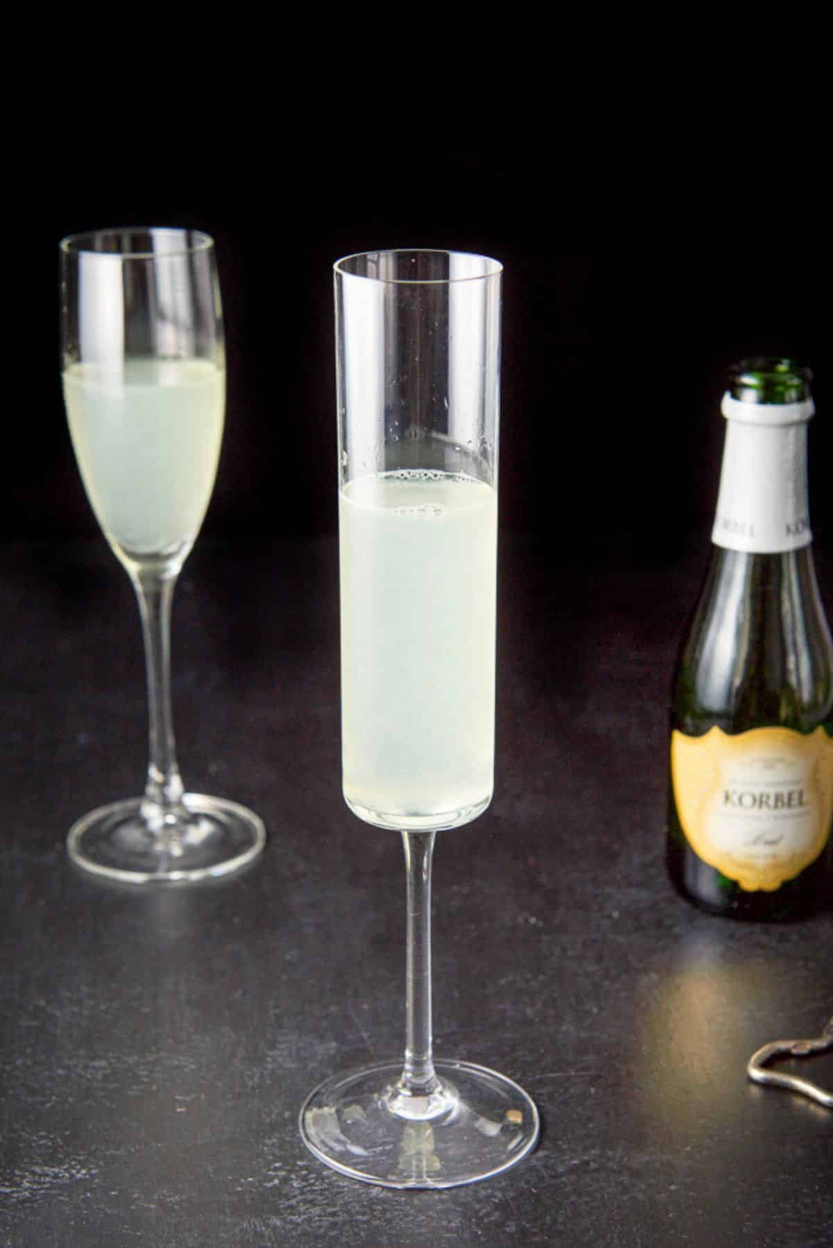 Champagne glasses filled 2/3 of the way up with the liquid before adding champagne