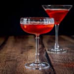 Two martini glasses filled with the classic red cocktail