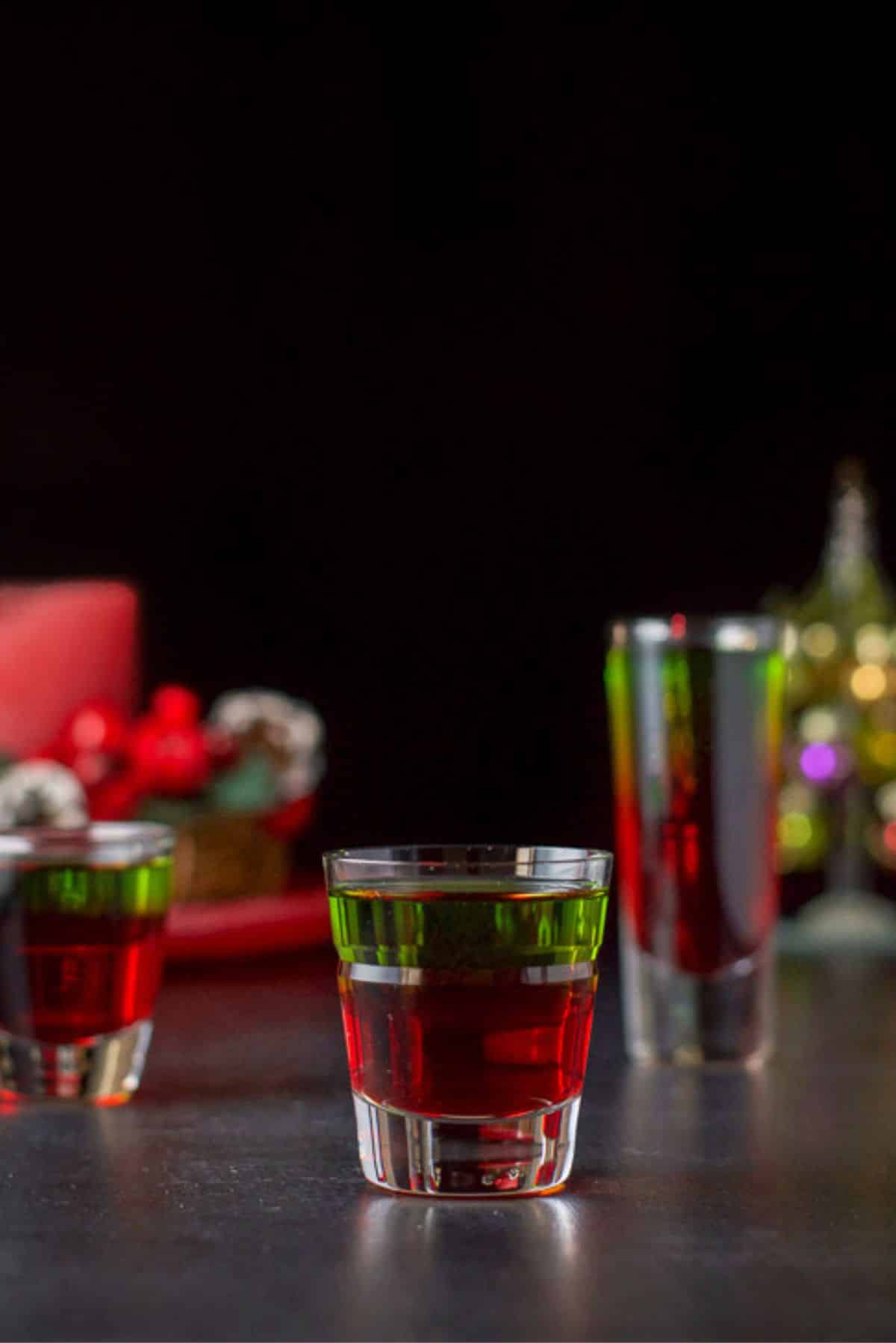 Vertical view of the three glasses filled with the layered shot