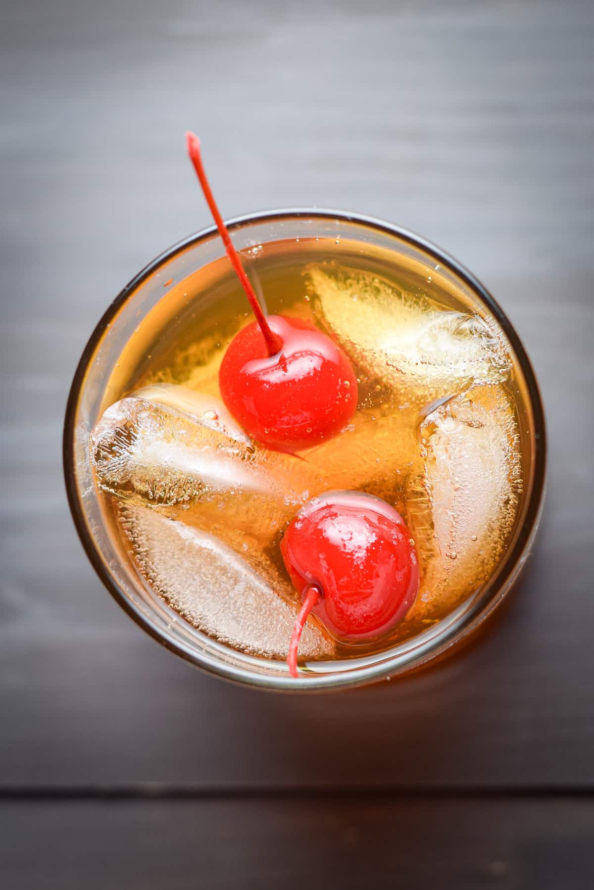 Overhead view of the cocktail with two cherries in it
