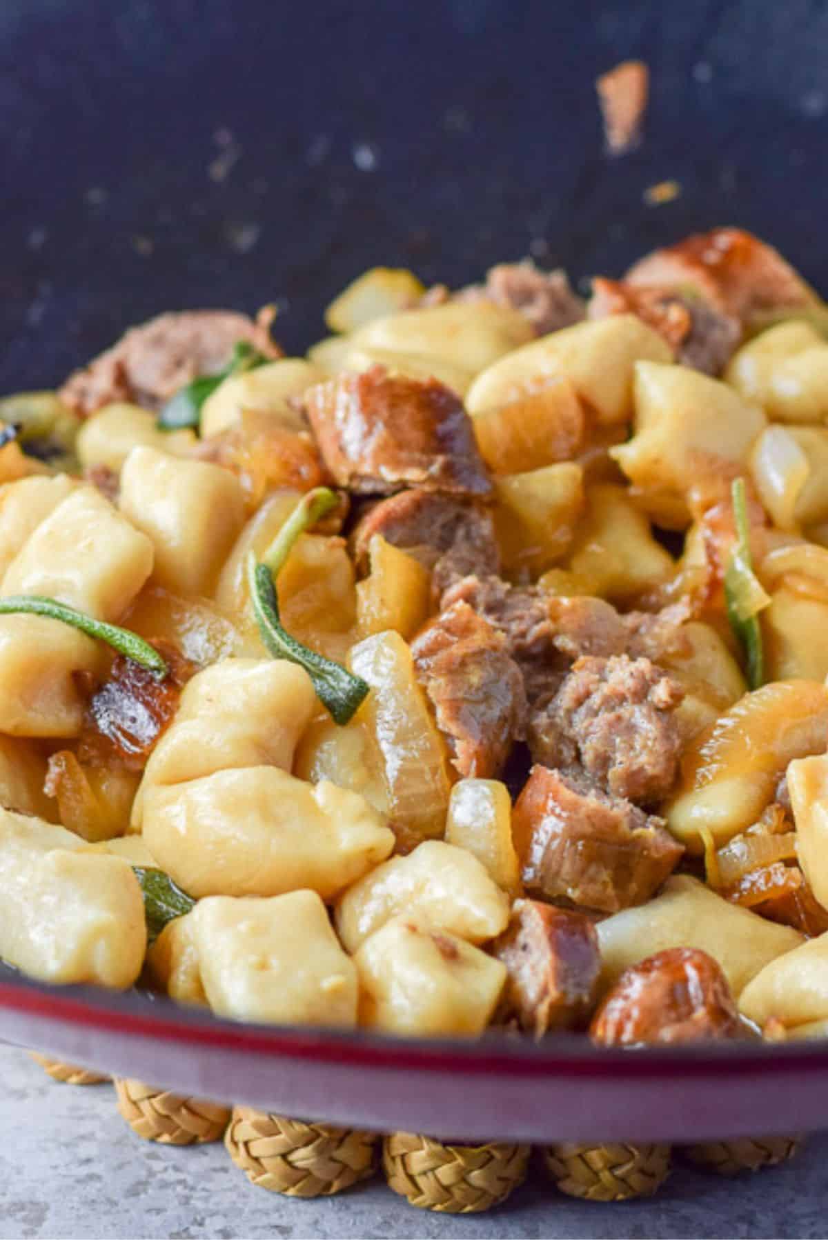 Cooked gnocchi added to the wok